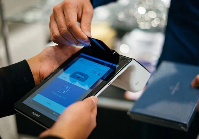 Person paying with a card