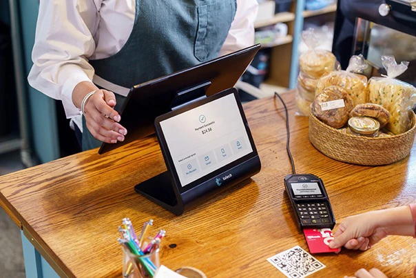 Customer paying with a card at a restaurant