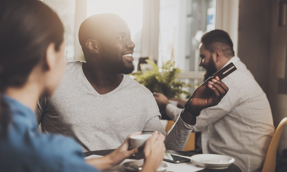 Man paying with a card in a restaurant