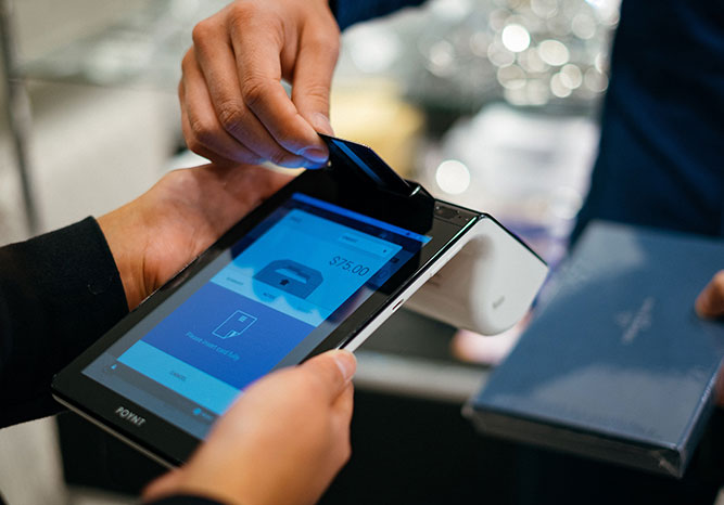 Person paying with a card