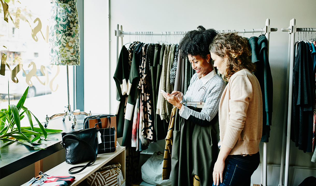 Two women shopping at a clothing store